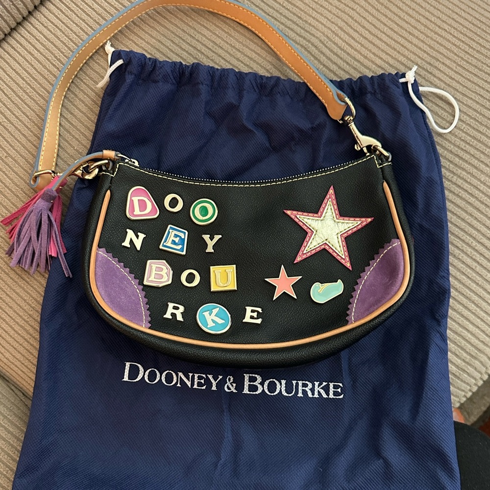 Dooney & Bourke Black leather crescent zip top purse